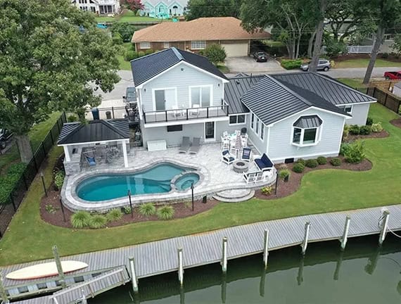 Custom Pool and backyard transformation at a waterfront home in Great Neck.