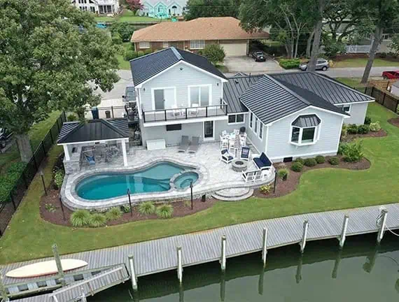Custom Pool and backyard transformation at a waterfront home in Great Neck.