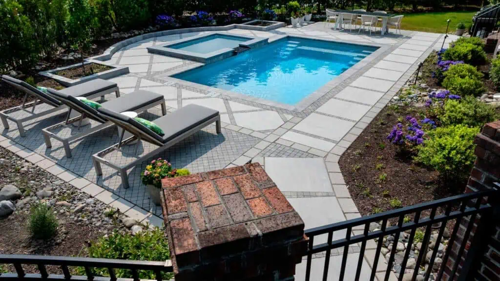 Bjorling-1 - Solid Structures Imagine Pools Freedom 23' fiberglass pool in Ice Silver with Mercury tanning ledge. Features include Gold equipment package with Jandy components, 1.85 HP variable speed pump, CV 340 cartridge filter, saltwater chlorination, iAqualink automation, and three Infinite Watercolors LED lights. Pool shape and color available at imaginepools.com.