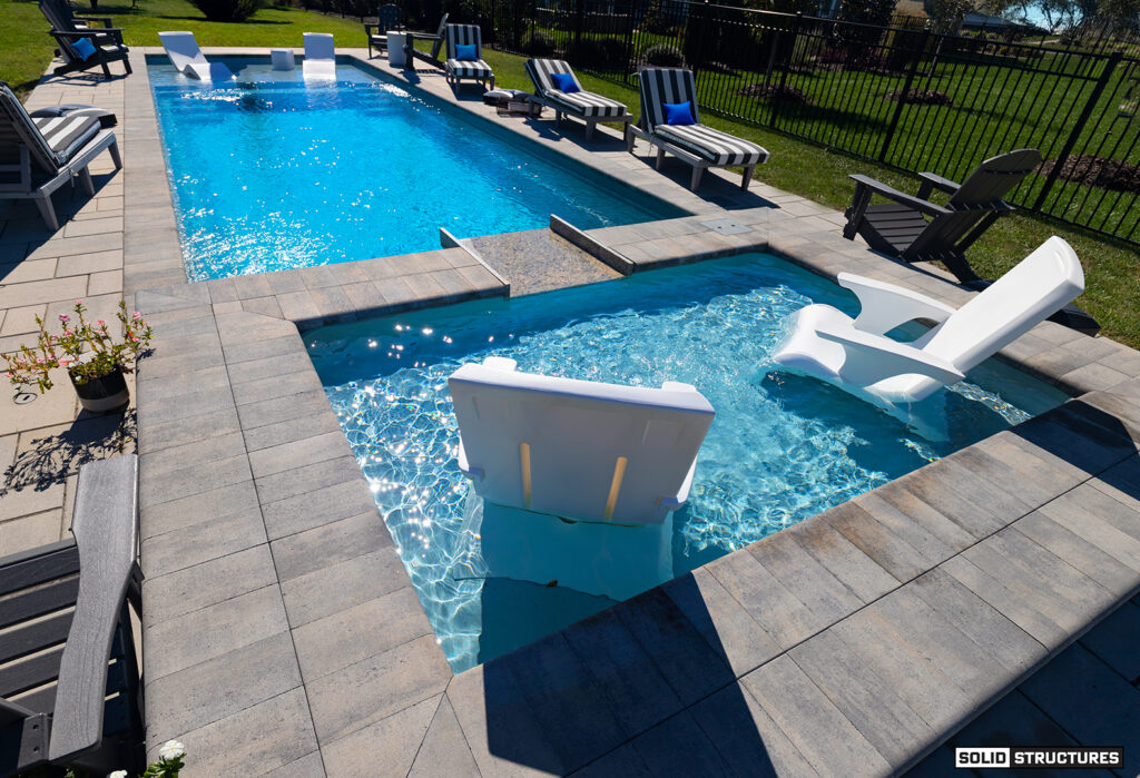 Solid Structures Installation of a Imagine Pools 38 Foot Freedom Fiberglass Pool in Ice Silver