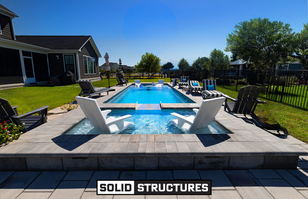 Solid Structures Installation of a Imagine Pools 38 Foot Freedom Fiberglass Pool in Ice Silver