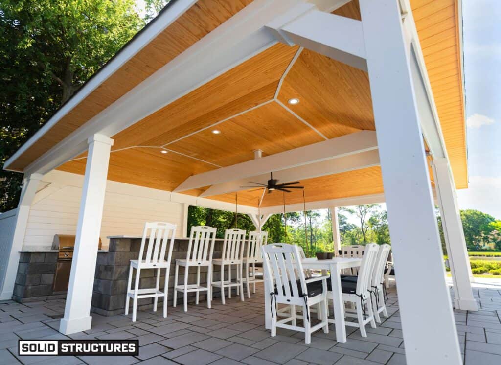 Techo Bloc Blu Hd2 60mm Smooth Patio Slabs in Beige Cream, 3-piece Pattern with Shale Accent Border in Soldier Course.