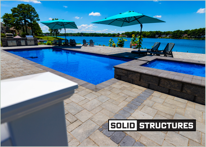 Rectangular pool with umbrellas by the bay
