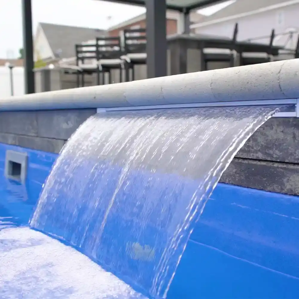 Waterfall feature on a custom swimming pool at the Solid Structures showroom in Virginia Beach.