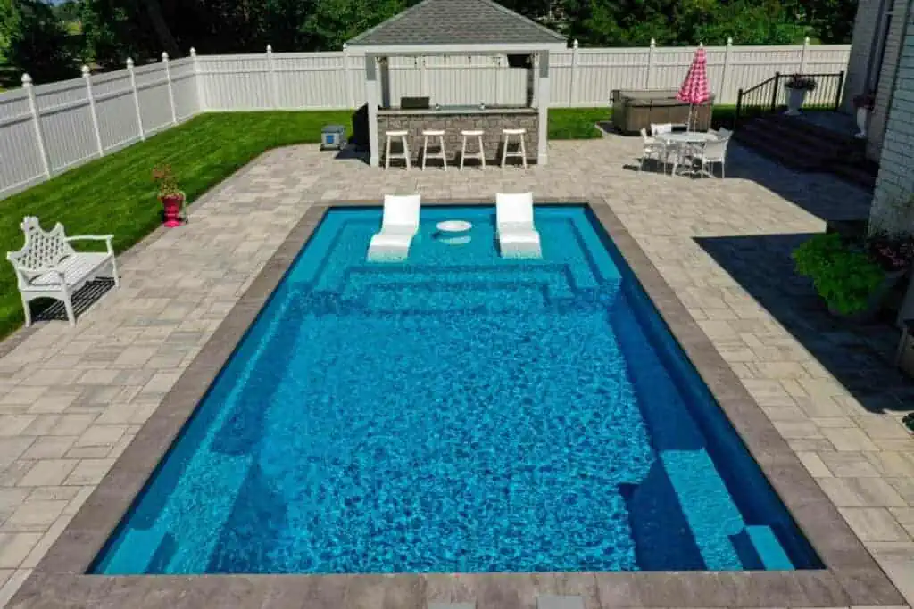 vinyl2 - Solid Structures Large Rectangular Pool with Vinyl Chairs and Shade Lounge
